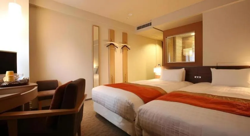 Bed in Ochanomizu Hotel Juraku