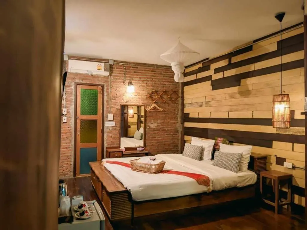 Bed in Huen Chang Puek Hotel