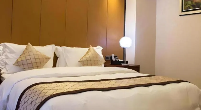 Bed in Auspicious Hotel
