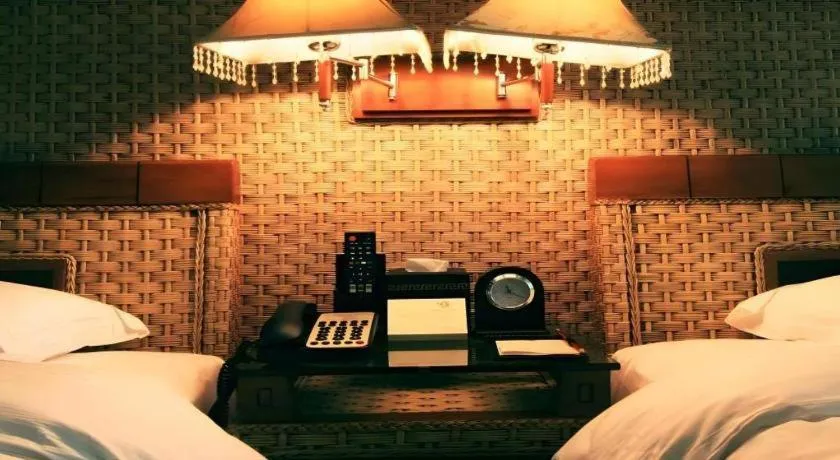 Bed in Fuzhou Chuanjie Hotspring and Golf Club Hotel