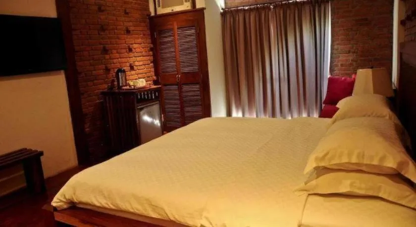 Bed in Mango Valley Hotel