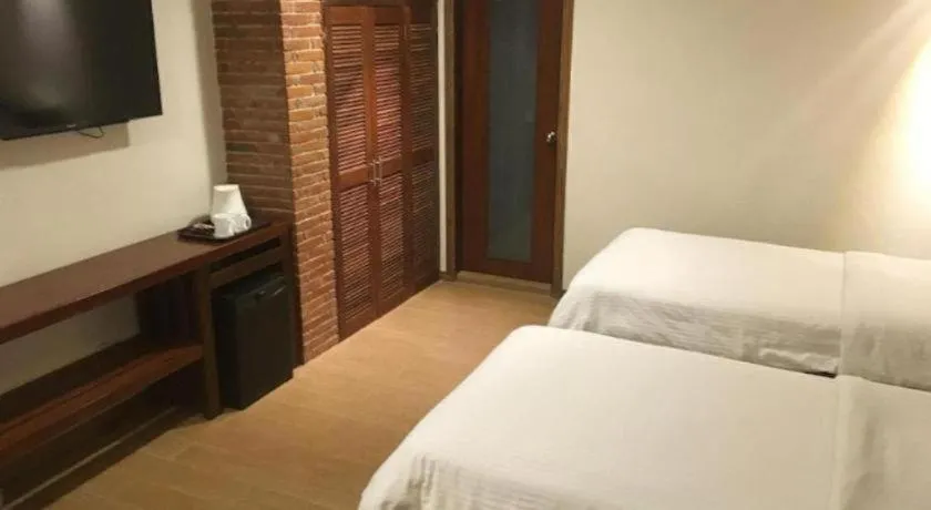 Bed in Mango Valley Hotel