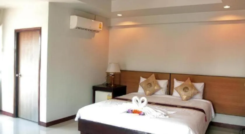 Bed in Century Grand Hotel