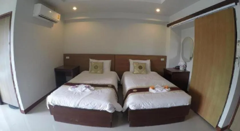 Bed in Century Grand Hotel