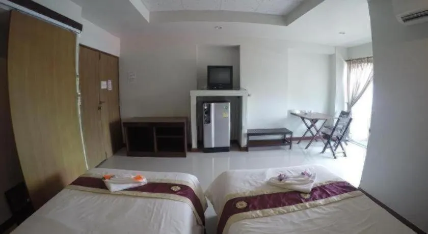 Bed in Century Grand Hotel