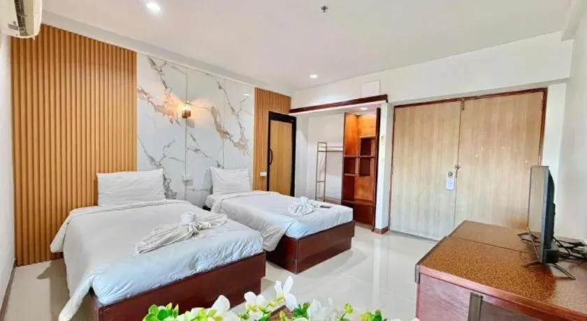 Bed in Century Grand Hotel