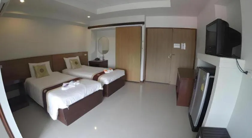 Bed in Century Grand Hotel