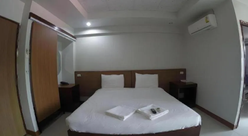 Bed in Century Grand Hotel