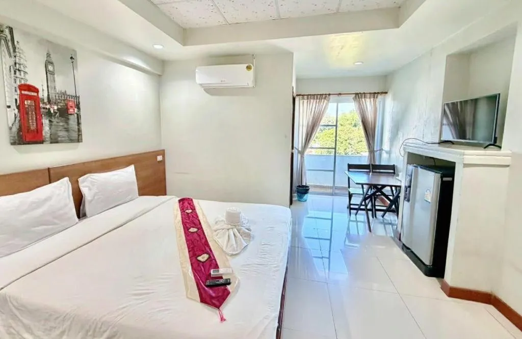 Bed in Century Grand Hotel