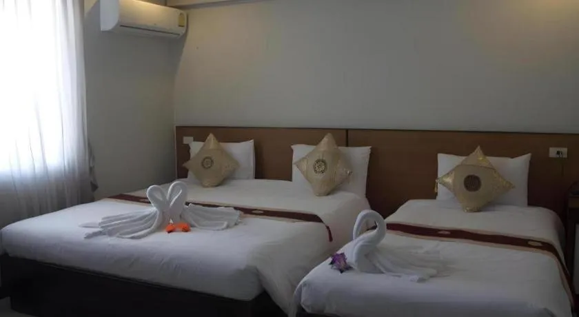 Bed in Century Grand Hotel