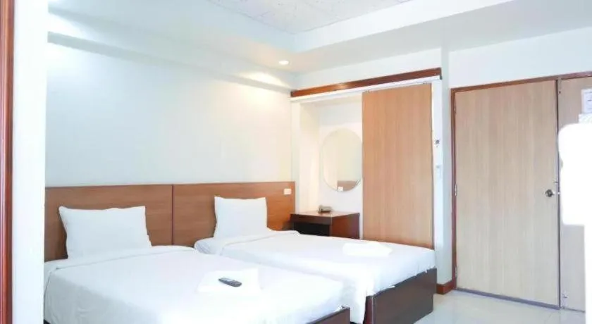 Bed in Century Grand Hotel