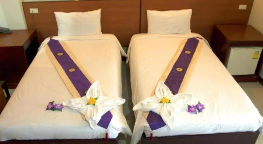 Bed in Century Grand Hotel