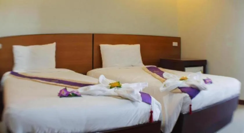 Bed in Century Grand Hotel