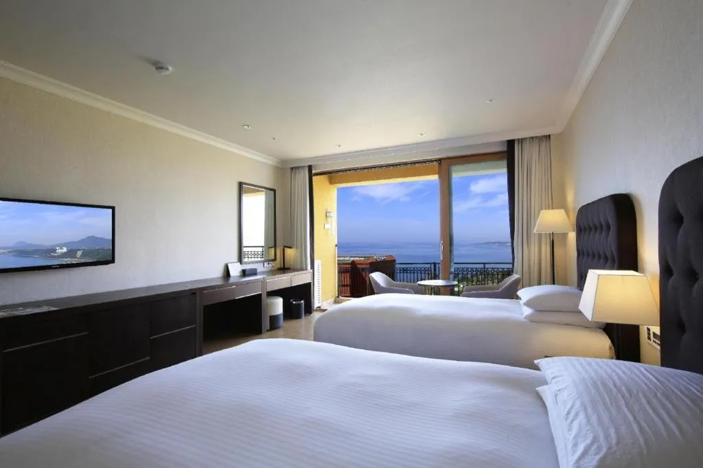 Bed in Jeju Booyoung Hotel