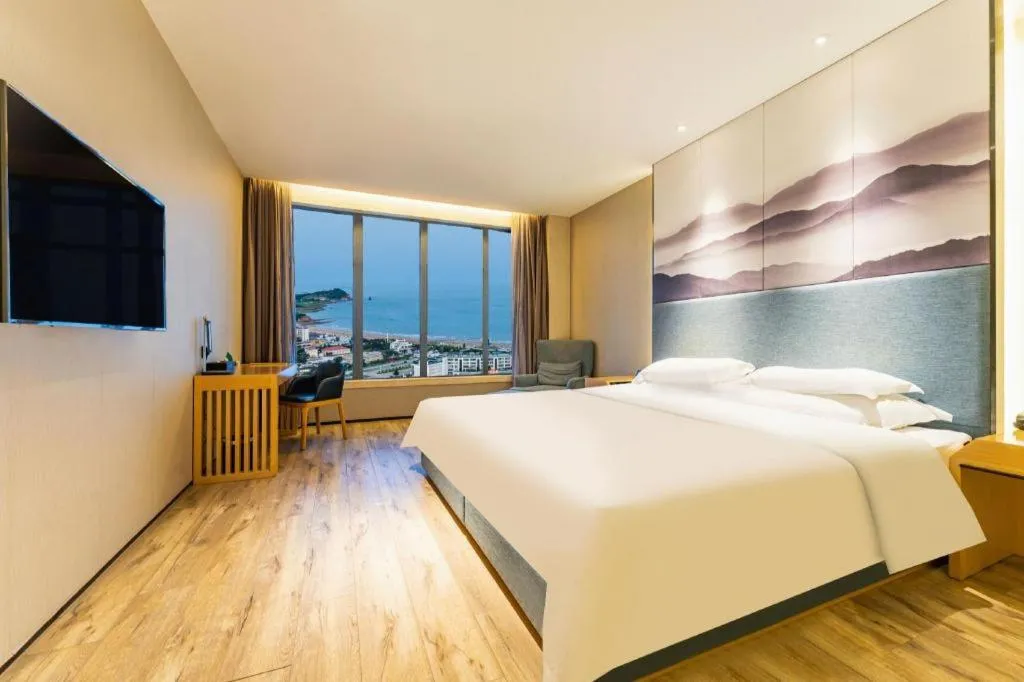 Bed in Qingdao Elegance Hotel