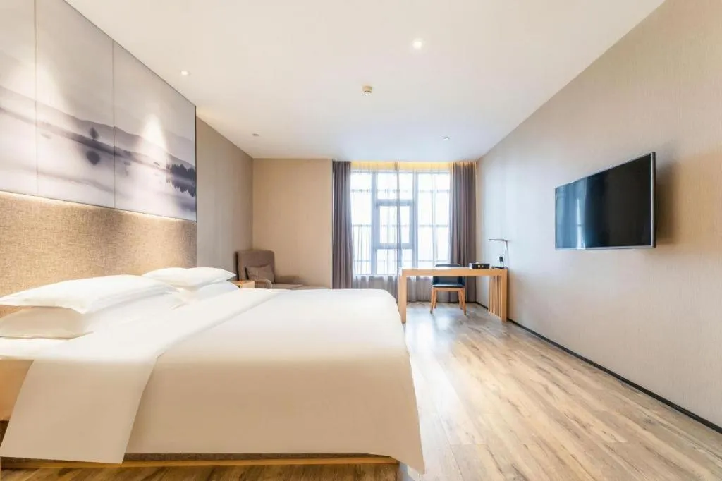 Bed in Qingdao Elegance Hotel