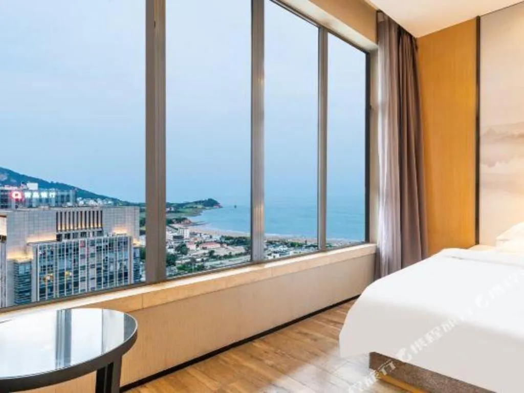 Bed in Qingdao Elegance Hotel