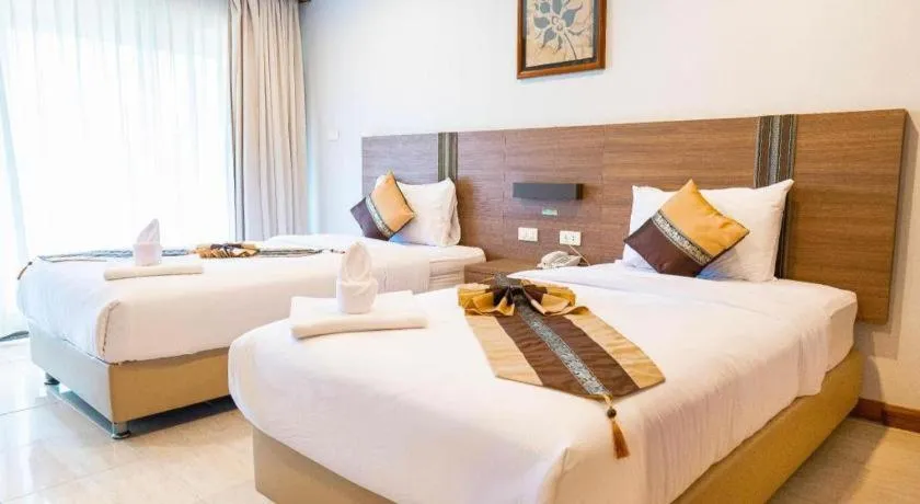 Bed in The Impress Nan Hotel