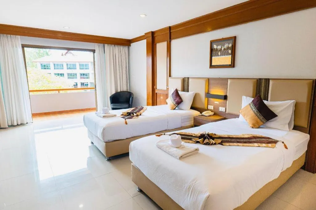 Bed in The Impress Nan Hotel