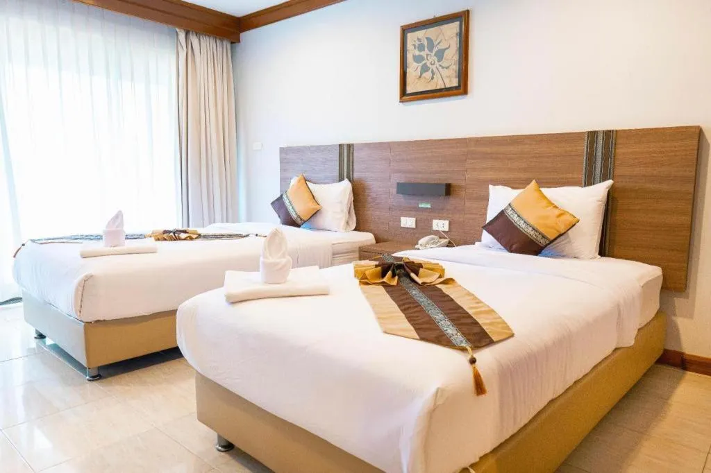 Bed in The Impress Nan Hotel