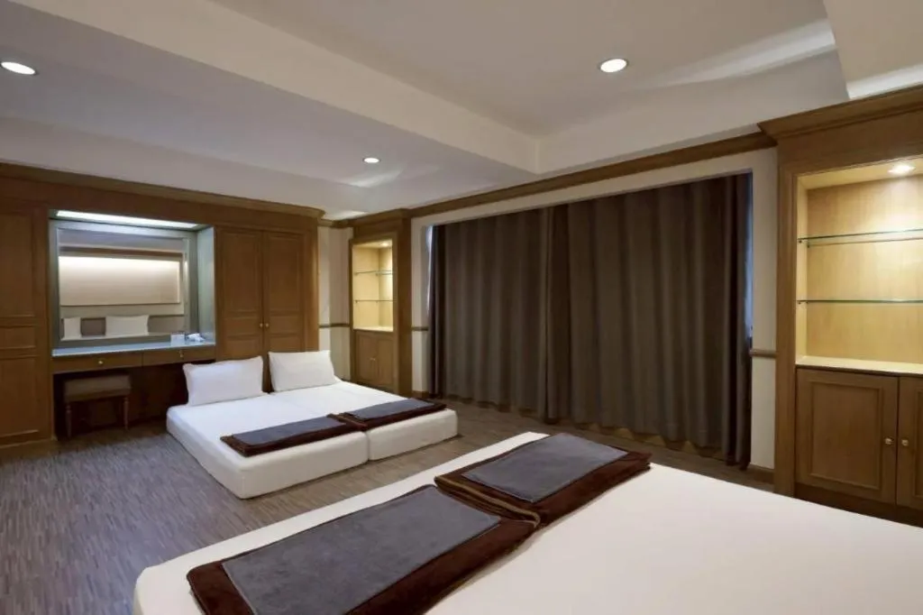 Bed in Alameda Suites Hotel