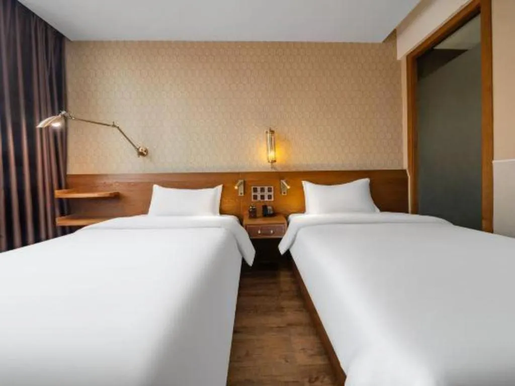 Bed in James Joyce Coffetel Wuxi Taihu Square Subway Station Branch