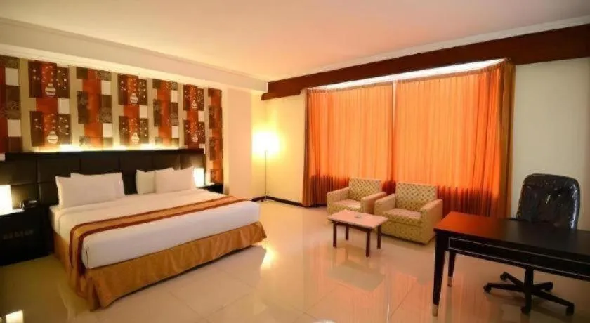 Bed in Grand Hotel Surabaya