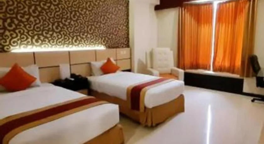 Bed in Grand Hotel Surabaya