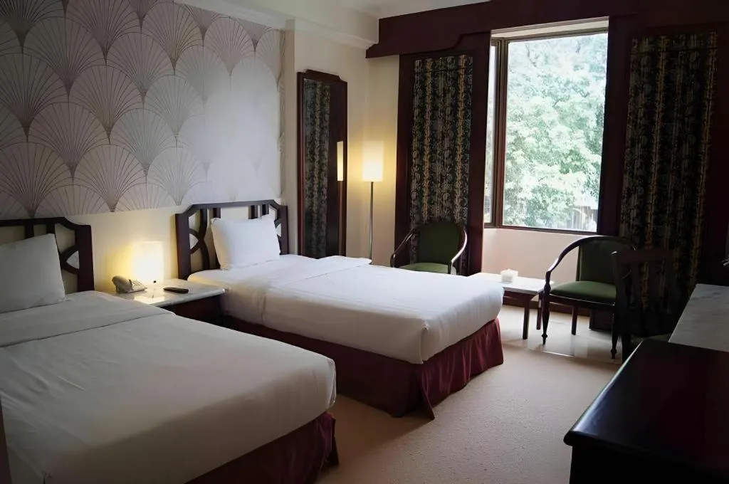 Bed in Grand Hotel Surabaya