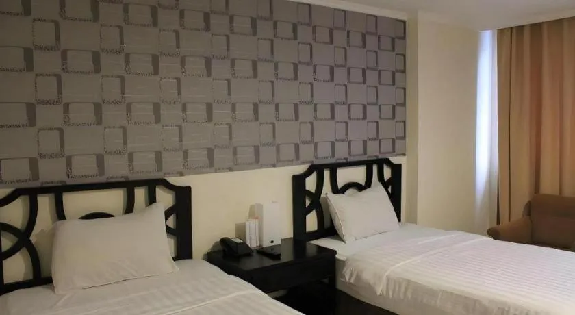 Bed in Grand Hotel Surabaya