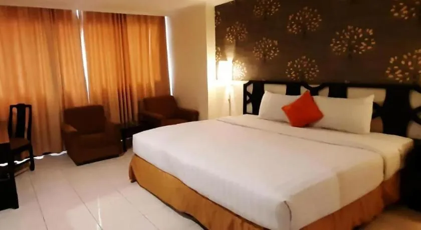 Bed in Grand Hotel Surabaya