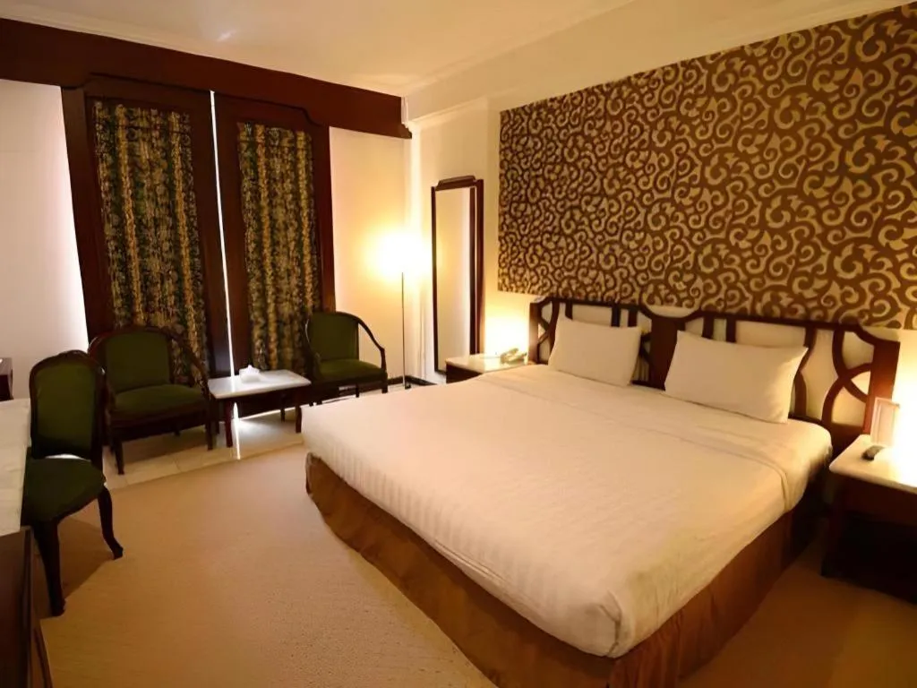 Bed in Grand Hotel Surabaya