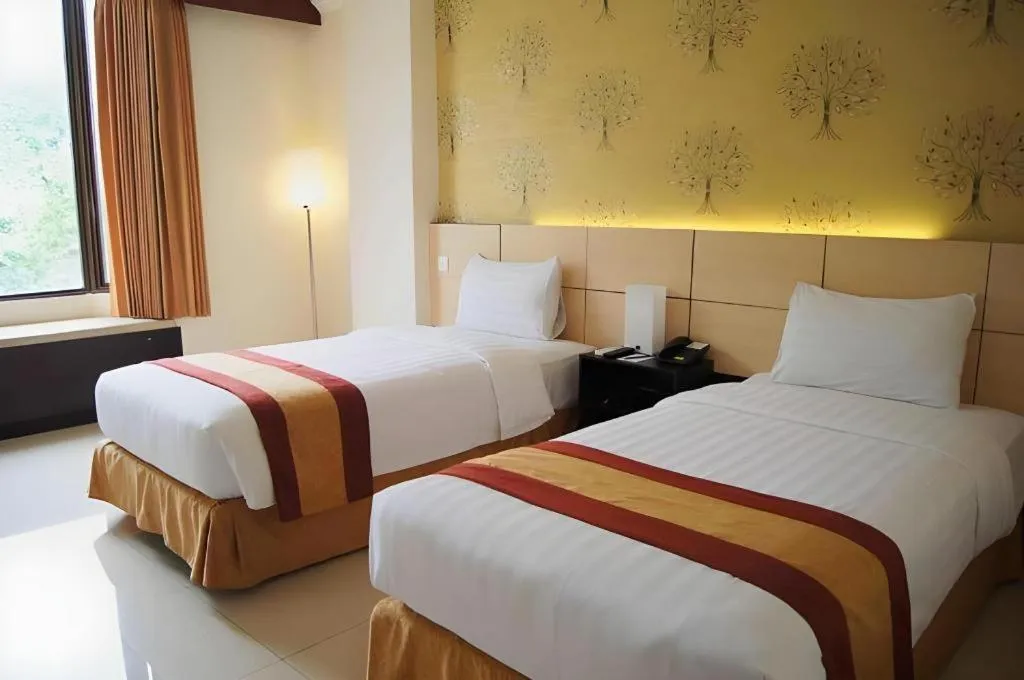 Bed in Grand Hotel Surabaya