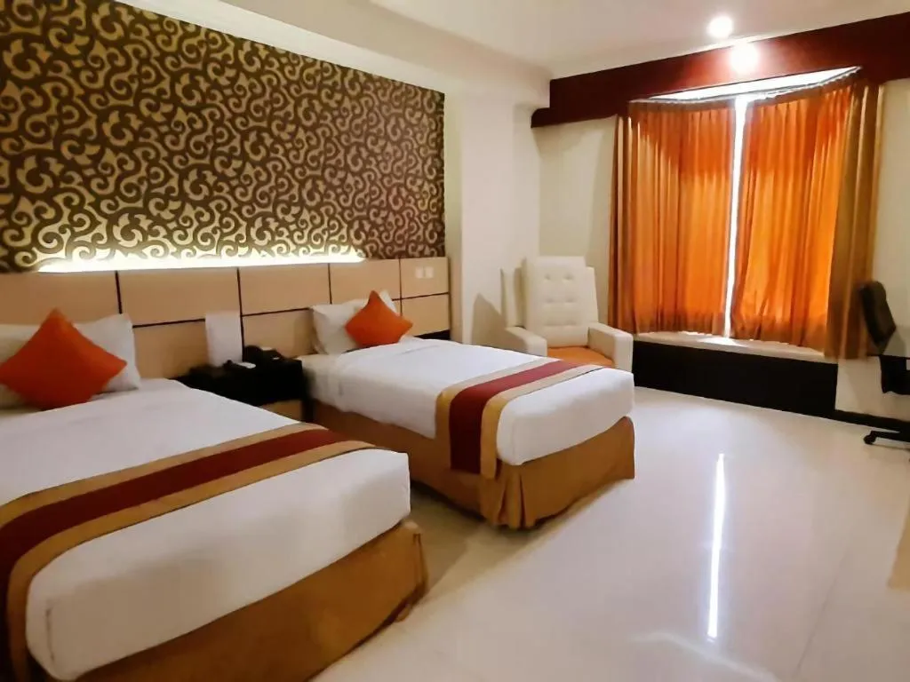 Bed in Grand Hotel Surabaya