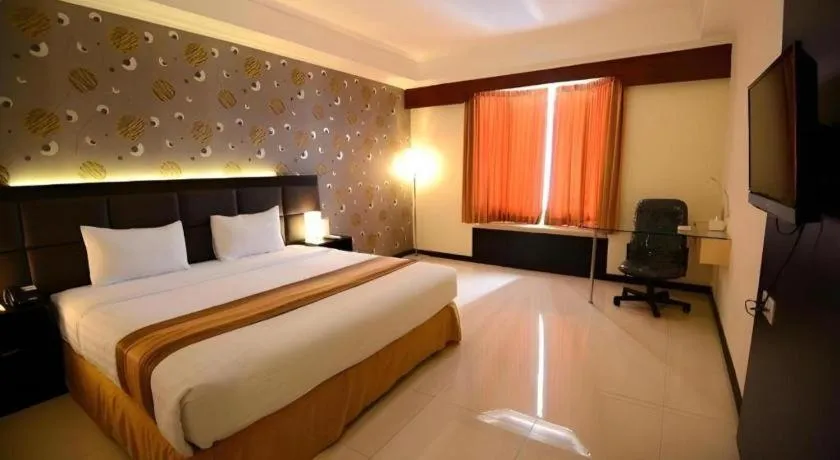 Bed in Grand Hotel Surabaya