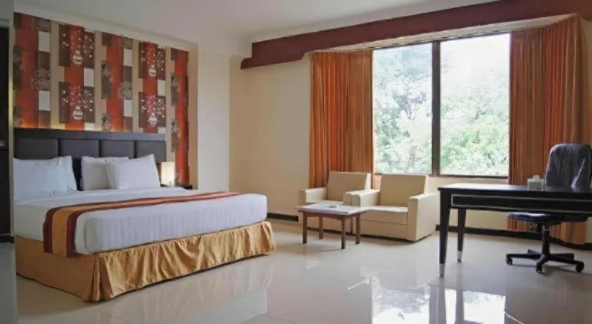 Bed in Grand Hotel Surabaya