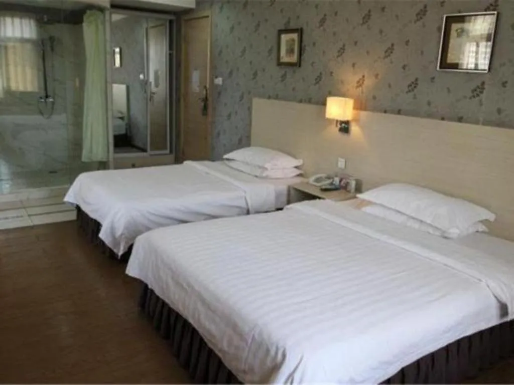 Bed in Pankun Business Hotel