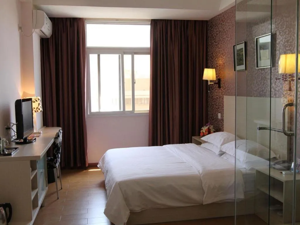 Bed in Pankun Business Hotel