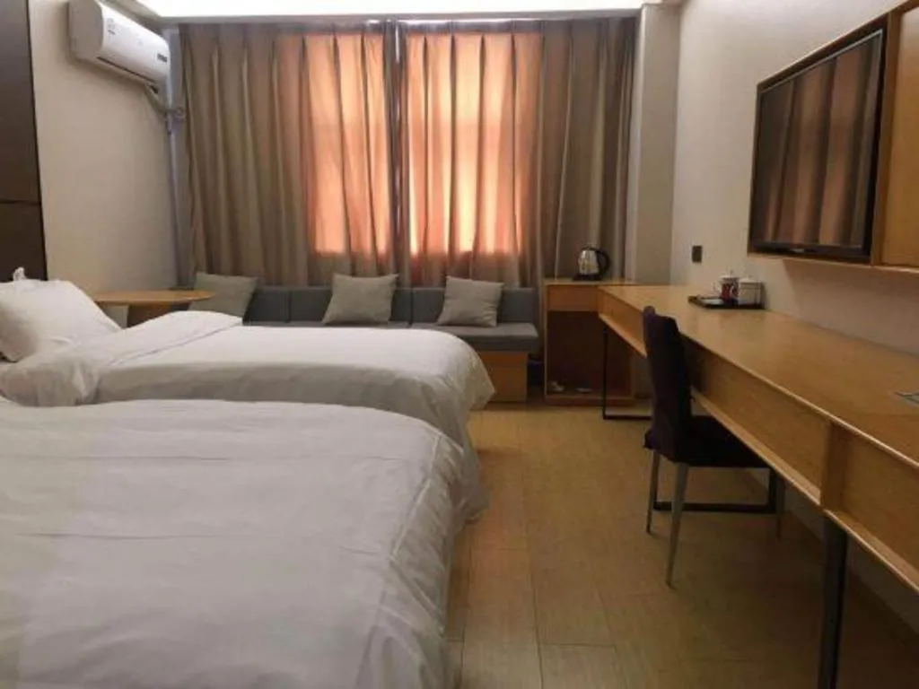 Bed in Pankun Business Hotel