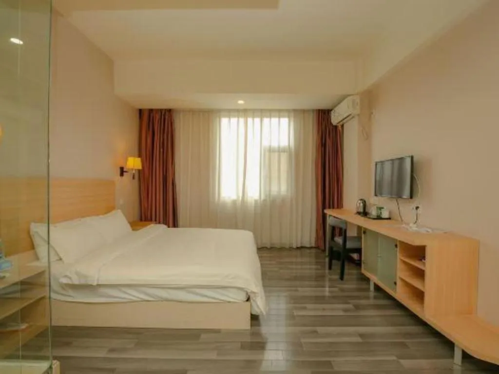 Bed in Pankun Business Hotel