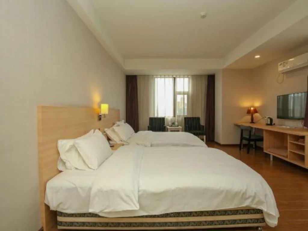 Bed in Pankun Business Hotel
