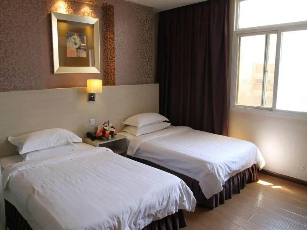 Bed in Pankun Business Hotel