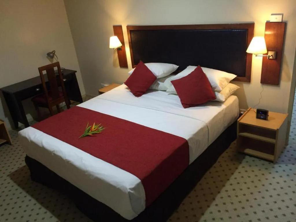 Bed in Victoria Palms Hotel