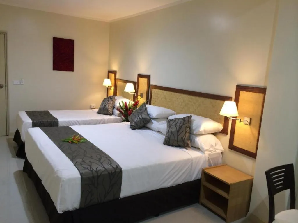 Bed in Victoria Palms Hotel