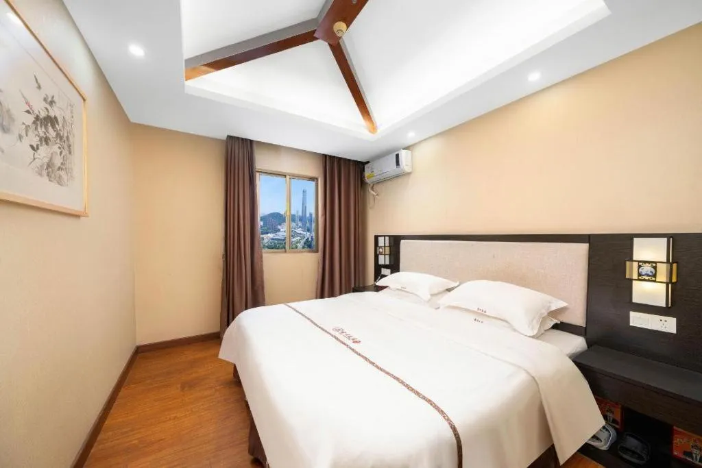 Bed in BOOK PAVILION HOTEL