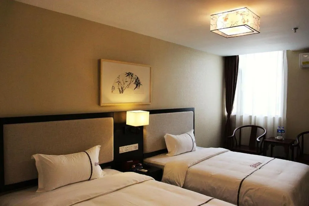 Bed in BOOK PAVILION HOTEL