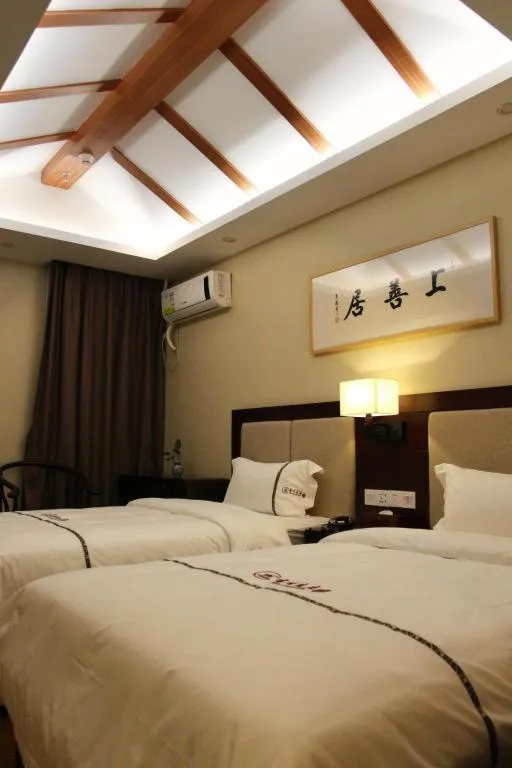 Bed in BOOK PAVILION HOTEL