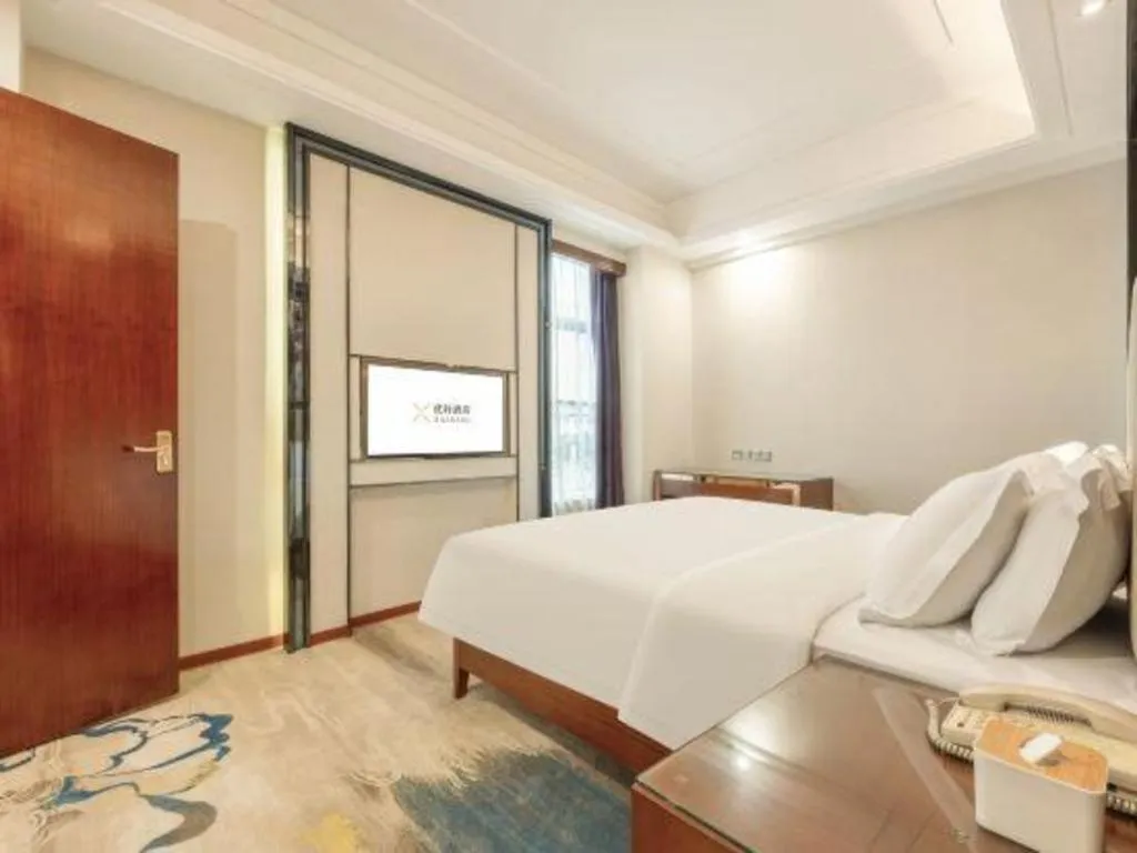 Bed in Vienna International Hotel Nanning Railway Station Mingxiu Road Metro Station