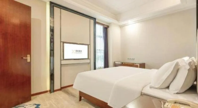 Bed in Vienna International Hotel Nanning Railway Station Mingxiu Road Metro Station