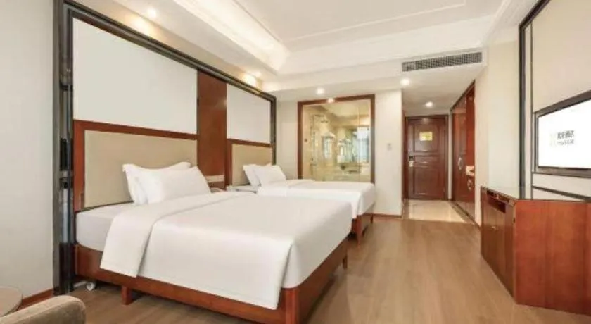 Bed in Vienna International Hotel Nanning Railway Station Mingxiu Road Metro Station